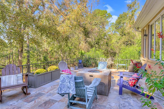 view of patio with an outdoor fire pit