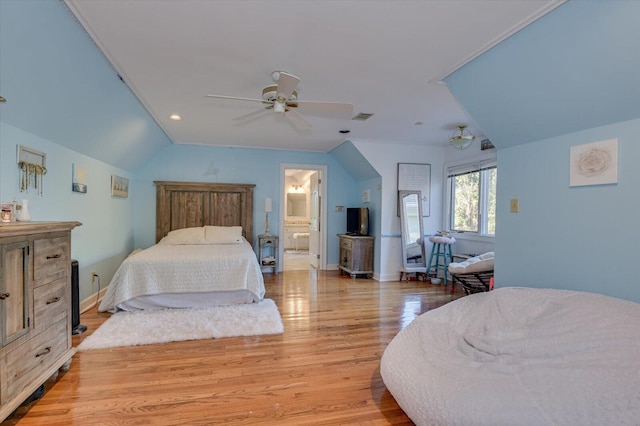 bedroom featuring lofted ceiling, ceiling fan, visible vents, baseboards, and light wood-style floors