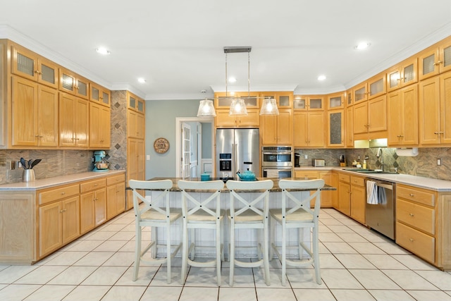 kitchen with glass insert cabinets, stainless steel appliances, light countertops, and a kitchen island