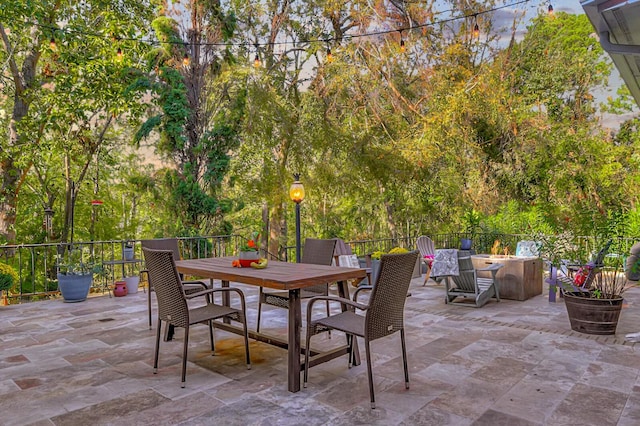 view of patio with outdoor dining space and a jacuzzi