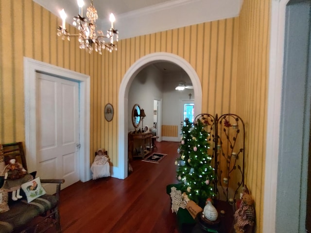 206 S Alexander Ave, Washington, GA 30673 - corridor with a chandelier, baseboards, arched walkways, wallpapered walls, and wood finished floors