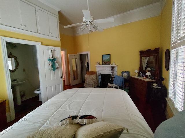 206 S Alexander Ave, Washington, GA 30673 - bedroom with ceiling fan, connected bathroom, and a fireplace