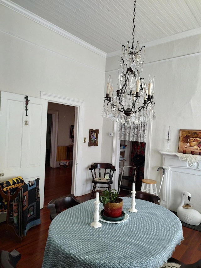 206 S Alexander Ave, Washington, GA 30673 - dining space with ornamental molding, a notable chandelier, and wood finished floors