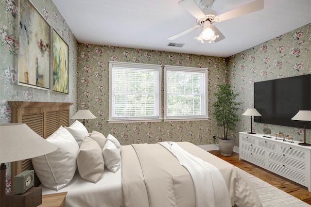 4142 Rivermont Dr, Evans, GA 30809 - bedroom with wood finished floors and ceiling fan