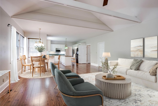 4142 Rivermont Dr, Evans, GA 30809 - living room featuring dark wood finished floors and a chandelier