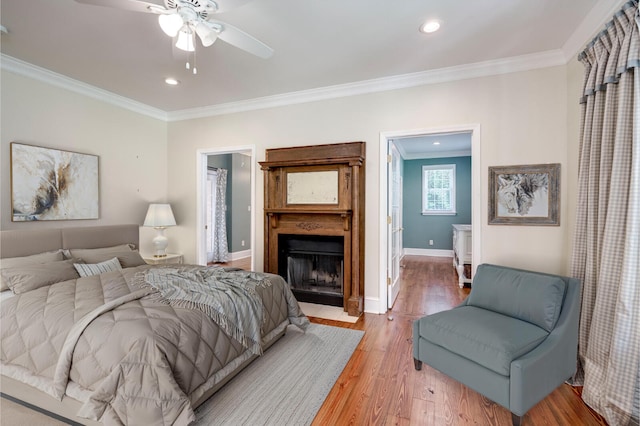 4142 Rivermont Dr, Evans, GA 30809 - bedroom with ornamental molding, light wood-style floors, recessed lighting, a fireplace with flush hearth, and ceiling fan