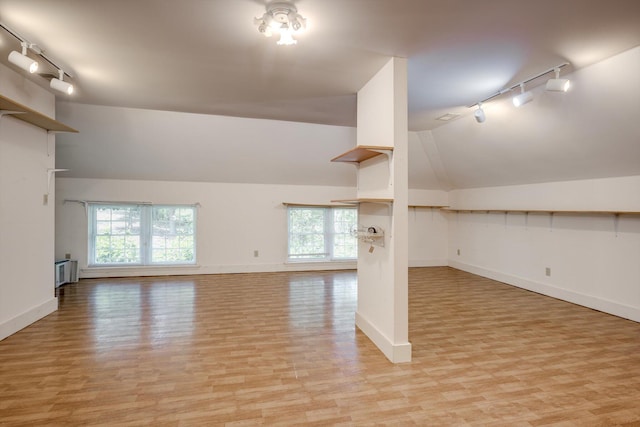 4142 Rivermont Dr, Evans, GA 30809 - unfurnished room featuring track lighting, light wood-type flooring, vaulted ceiling, and healthy amount of natural light