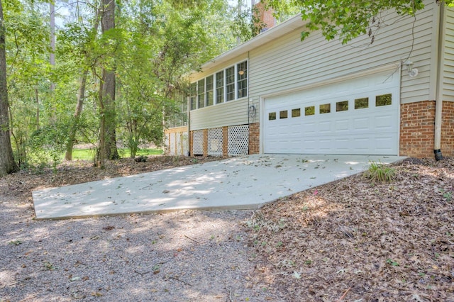 4142 Rivermont Dr, Evans, GA 30809 - view of property exterior featuring brick siding, a garage, and driveway