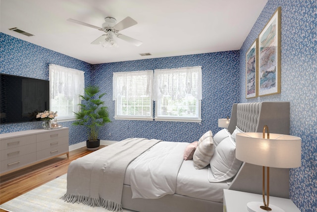 4142 Rivermont Dr, Evans, GA 30809 - bedroom featuring wood finished floors, wallpapered walls, and a ceiling fan
