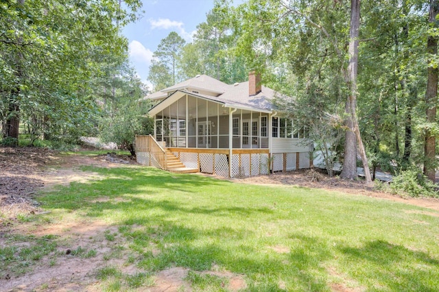 4142 Rivermont Dr, Evans, GA 30809 - rear view of property featuring a sunroom, stairs, a chimney, and a lawn