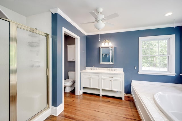 4142 Rivermont Dr, Evans, GA 30809 - full bath featuring double vanity, a shower stall, a garden tub, ornamental molding, and wood finished floors