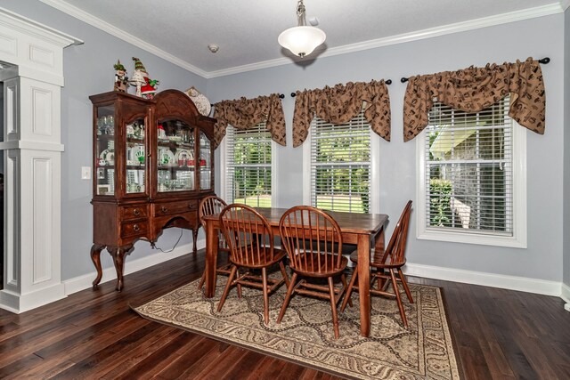 dining space featuring ornamental molding and dark wood-type flooring