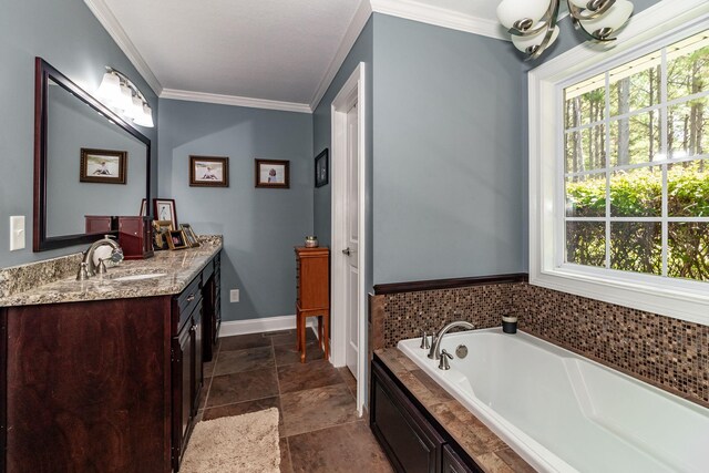 bathroom featuring vanity, a healthy amount of sunlight, crown molding, and a tub