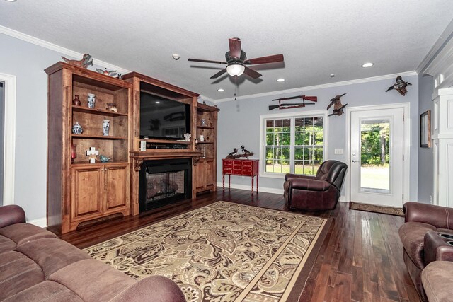 living room featuring a textured ceiling, ceiling fan, dark hardwood / wood-style flooring, and crown molding