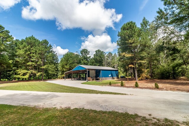 view of home's community with a yard and a carport