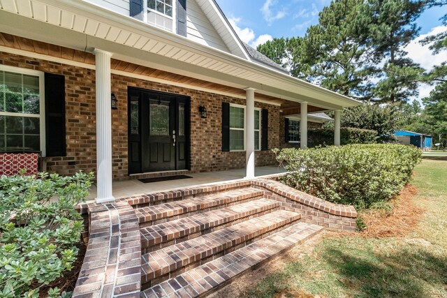 property entrance with a porch