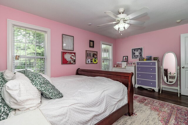 bedroom with ceiling fan and wood-type flooring