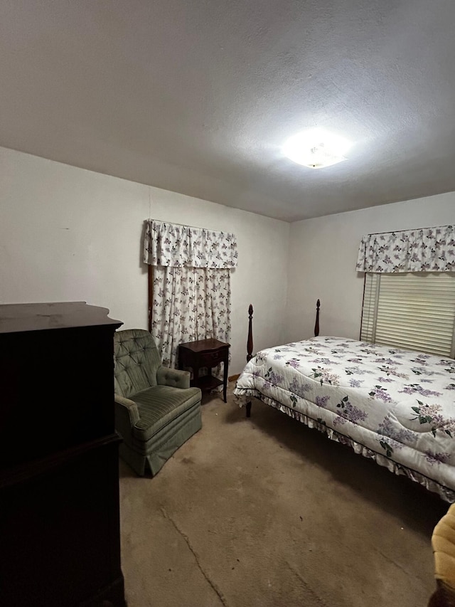 412 W 9th St, Waynesboro, GA 30830 - carpeted bedroom with a textured ceiling