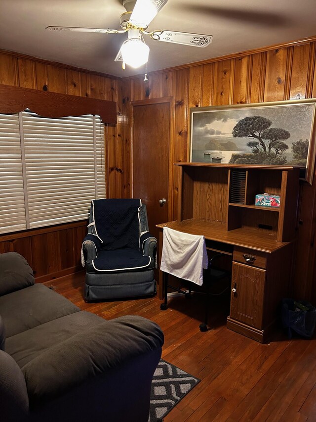 412 W 9th St, Waynesboro, GA 30830 - home office with dark wood finished floors, wooden walls, and a ceiling fan