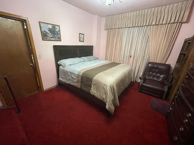 412 W 9th St, Waynesboro, GA 30830 - bedroom featuring carpet, baseboards, and a textured ceiling