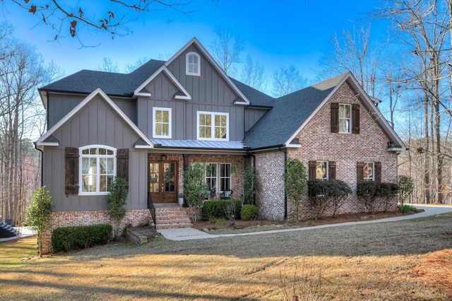 649 Bent Creek Dr, Evans, GA 30809 - craftsman-style home featuring brick siding, board and batten siding, a shingled roof, and a front lawn