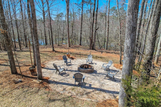 649 Bent Creek Dr, Evans, GA 30809 - view of yard with a patio, a wooded view, and an outdoor fire pit