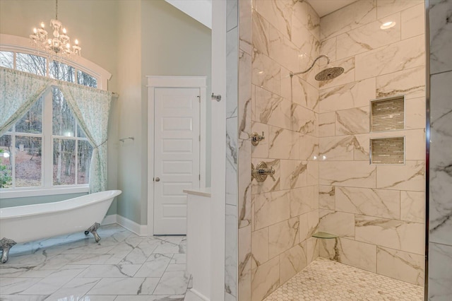 649 Bent Creek Dr, Evans, GA 30809 - bathroom with marble finish floor, tiled shower, baseboards, a soaking tub, and a chandelier