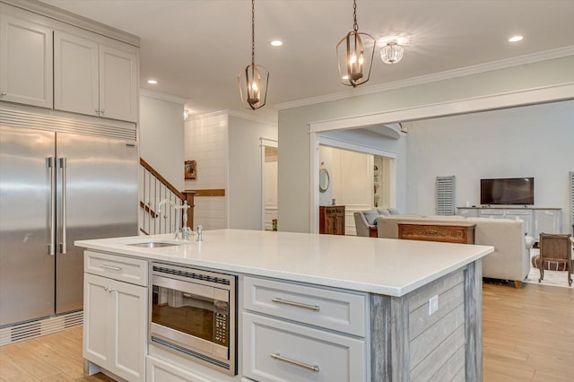 649 Bent Creek Dr, Evans, GA 30809 - kitchen with a sink, built in appliances, light wood-style floors, and open floor plan