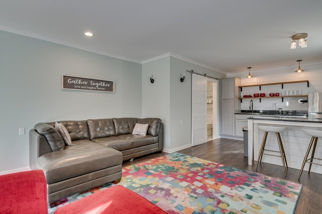 649 Bent Creek Dr, Evans, GA 30809 - living area featuring ornamental molding, wet bar, baseboards, and dark wood-style flooring