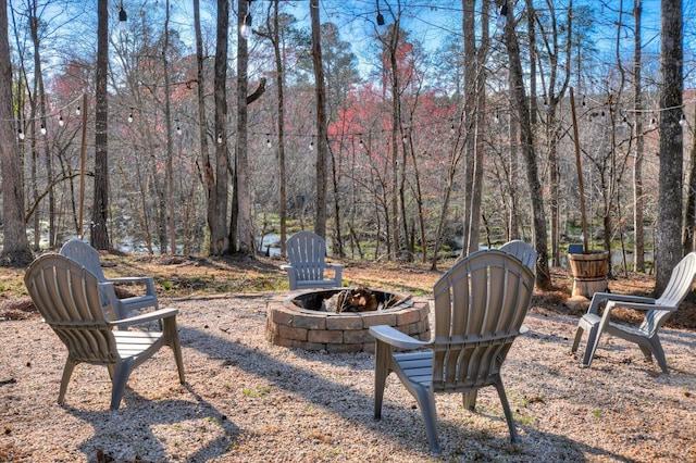 649 Bent Creek Dr, Evans, GA 30809 - view of yard featuring a fire pit and a wooded view