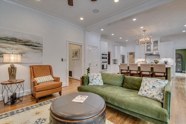 704 Summergate Ct, Augusta, GA 30909 - living room with a chandelier, ornamental molding, recessed lighting, light wood-style flooring, and ceiling fan