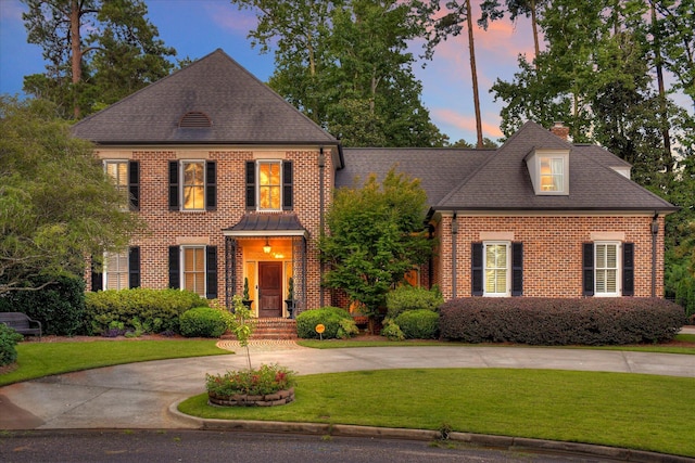 704 Summergate Ct, Augusta, GA 30909 - colonial home featuring brick siding, a lawn, a chimney, and a shingled roof