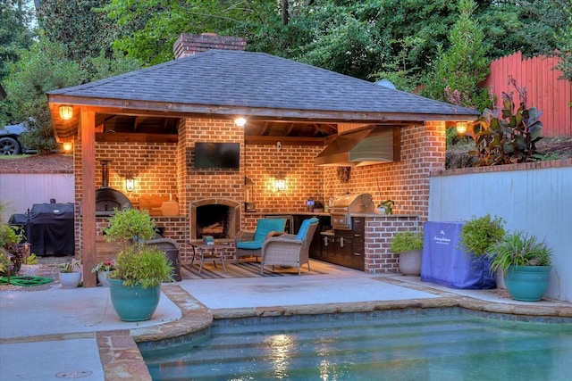 704 Summergate Ct, Augusta, GA 30909 - view of swimming pool with a brick fireplace, exterior kitchen, and a patio area