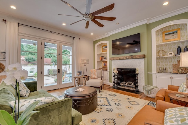 704 Summergate Ct, Augusta, GA 30909 - living room featuring a ceiling fan, light wood-type flooring, crown molding, built in shelves, and recessed lighting