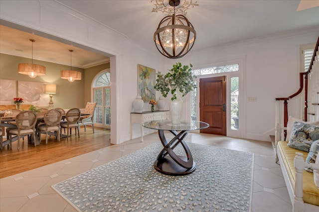 704 Summergate Ct, Augusta, GA 30909 - foyer featuring light tile patterned floors, a chandelier, crown molding, and stairway