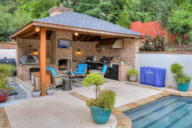704 Summergate Ct, Augusta, GA 30909 - view of patio / terrace featuring a brick fireplace, area for grilling, and a gazebo