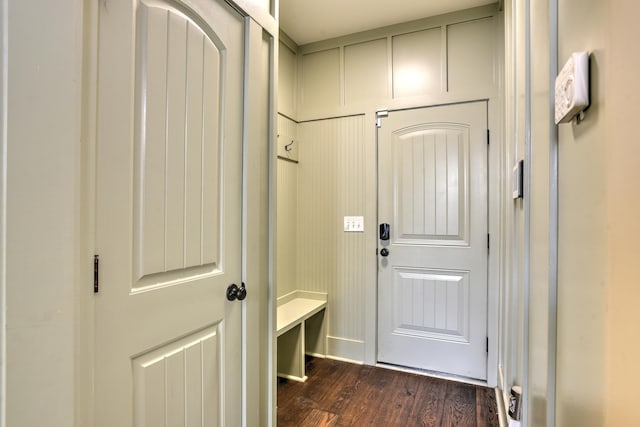 doorway with dark hardwood / wood-style flooring