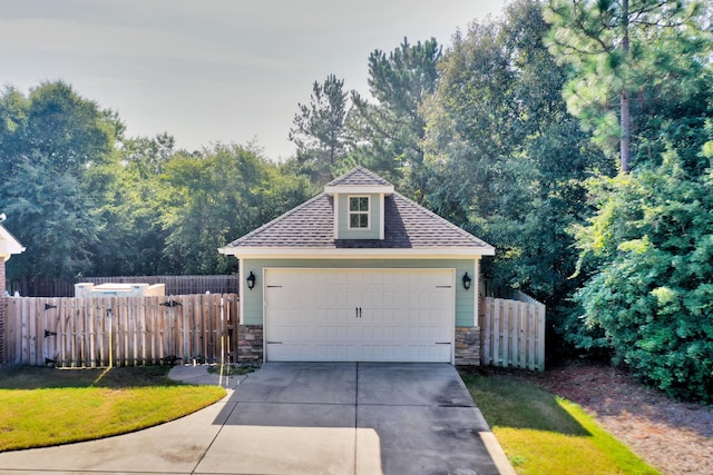 garage featuring a yard