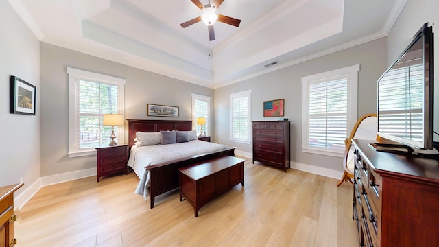 243 Walton Heath Way, Aiken, SC 29803 - bedroom with a tray ceiling, light wood-style floors, multiple windows, ornamental molding, and baseboards