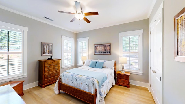 243 Walton Heath Way, Aiken, SC 29803 - bedroom featuring light wood-type flooring, multiple windows, baseboards, and crown molding