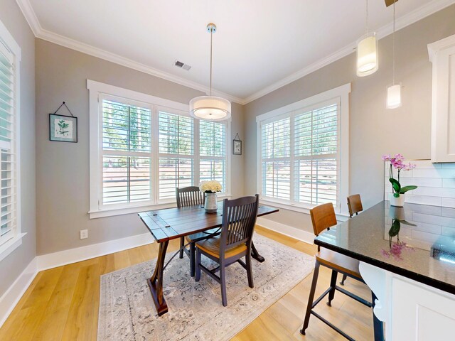 243 Walton Heath Way, Aiken, SC 29803 - dining room featuring healthy amount of natural light, light wood-type flooring, ornamental molding, and baseboards