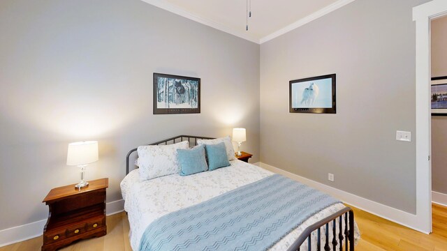 243 Walton Heath Way, Aiken, SC 29803 - bedroom with crown molding, baseboards, and light wood-type flooring