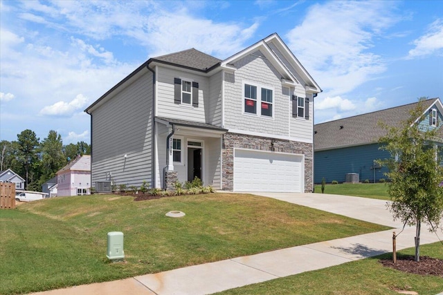 craftsman-style home featuring a garage, a front yard, and central AC