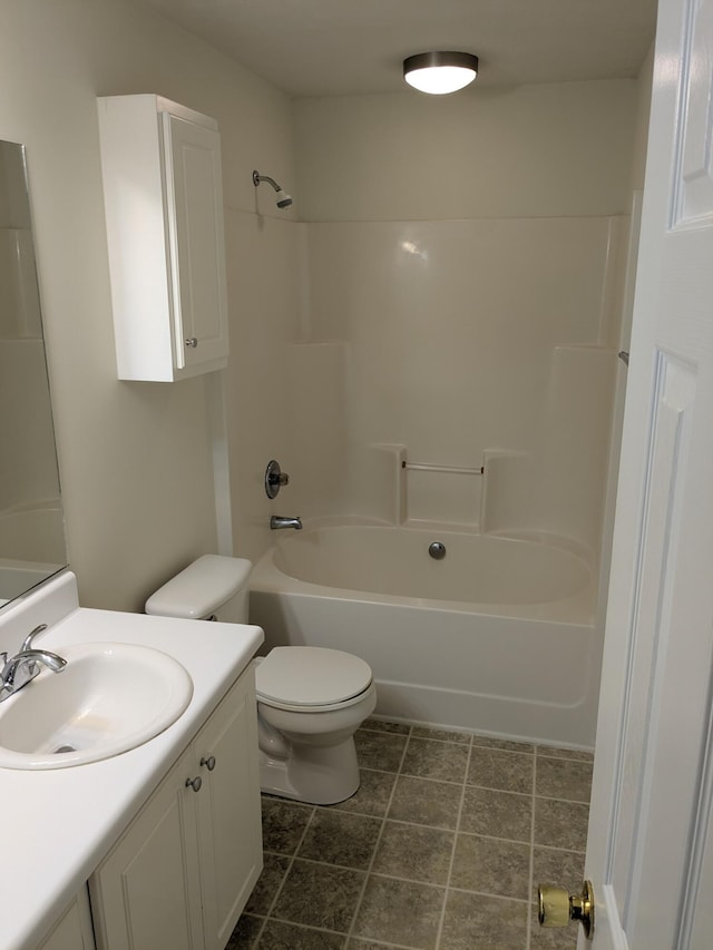 bathroom featuring bathing tub / shower combination, toilet, and vanity