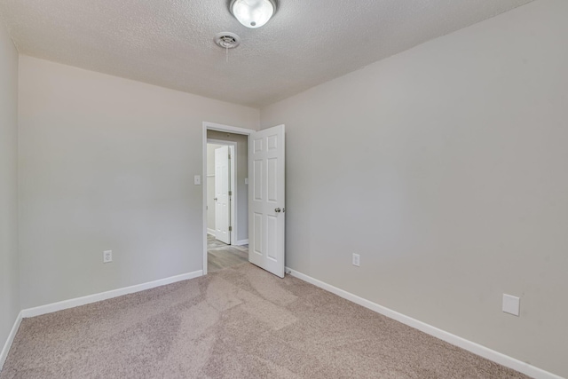 2206 Church Hill Ct, Augusta, GA 30906 - empty room with baseboards, a textured ceiling, and light colored carpet
