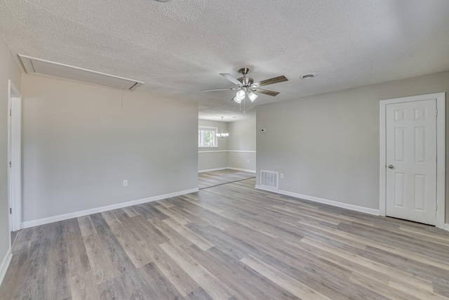 2206 Church Hill Ct, Augusta, GA 30906 - spare room with visible vents, a ceiling fan, light wood-type flooring, attic access, and a textured ceiling