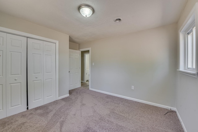 2206 Church Hill Ct, Augusta, GA 30906 - unfurnished bedroom with visible vents, baseboards, carpet, and a closet