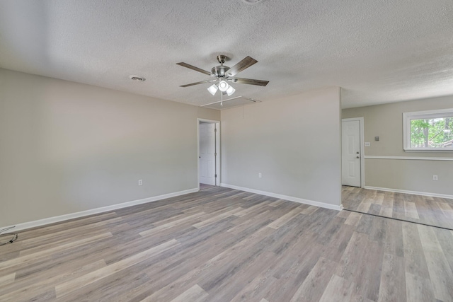 2206 Church Hill Ct, Augusta, GA 30906 - spare room with attic access, a textured ceiling, visible vents, a ceiling fan, and wood finished floors