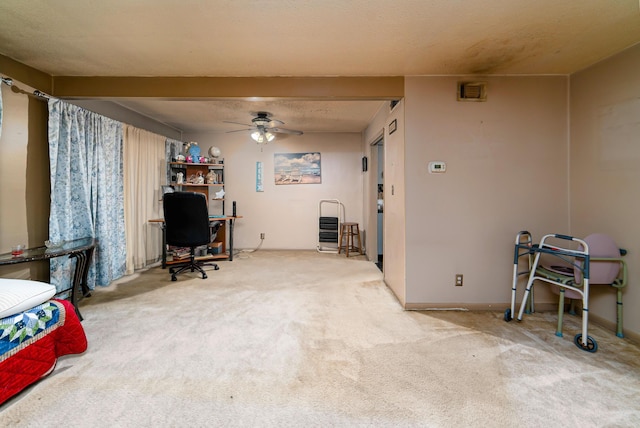 interior space with ceiling fan and beamed ceiling