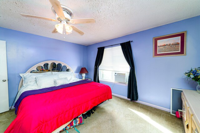 carpeted bedroom with a textured ceiling, ceiling fan, and cooling unit